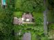 An aerial view shows lush landscaping and a sprawling property at 1136 S Edgemont Ave, Gastonia, NC 28054
