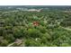 Aerial view of a house nestled in lush green trees in a quiet neighborhood at 1136 S Edgemont Ave, Gastonia, NC 28054