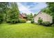 Beautiful backyard showcasing the home's exterior and lush green lawn at 1136 S Edgemont Ave, Gastonia, NC 28054