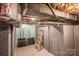 Spacious basement with gray brick walls, exposed ventilation and duct work at 1136 S Edgemont Ave, Gastonia, NC 28054