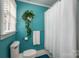 Neat bathroom featuring a shower, toilet, and window with natural light at 1136 S Edgemont Ave, Gastonia, NC 28054