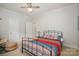 Comfortable bedroom with a unique bed frame and soft natural light at 1136 S Edgemont Ave, Gastonia, NC 28054
