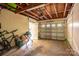 Large garage with an automatic door, offering secure parking and storage space at 1136 S Edgemont Ave, Gastonia, NC 28054