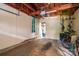 Spacious garage featuring exposed wooden beams, ready for customization and storage solutions at 1136 S Edgemont Ave, Gastonia, NC 28054