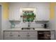Charming kitchen featuring white cabinets, subway tile backsplash, and a window with natural light at 1136 S Edgemont Ave, Gastonia, NC 28054