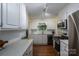 Spacious kitchen with stainless steel appliances, white cabinets, and hardwood floors at 1136 S Edgemont Ave, Gastonia, NC 28054