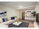 Stylishly furnished living room with a modern sofa, a blue rug, and a kitchen area, designed for comfort at 1136 S Edgemont Ave, Gastonia, NC 28054