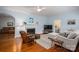 Comfortable living room with a fireplace, hardwood floors, and ample seating at 1136 S Edgemont Ave, Gastonia, NC 28054