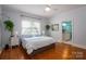 Serene main bedroom with hardwood floors and an ensuite bathroom at 1136 S Edgemont Ave, Gastonia, NC 28054