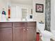 Well-lit bathroom with double vanity, tile flooring, and soft decorative accents at 12217 Dearview Ln, Charlotte, NC 28269