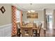 Bright dining room featuring hardwood floors, modern decor, and natural light creates a comfortable area at 12217 Dearview Ln, Charlotte, NC 28269