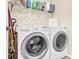 Bright laundry room with front loading LG washer and dryer and wire shelving for storage at 12217 Dearview Ln, Charlotte, NC 28269