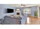 Cozy living room featuring a fireplace, large sofa, and hardwood floors offers comfortable living space at 12217 Dearview Ln, Charlotte, NC 28269