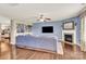 Comfortable living room features a fireplace, large blue sofa, and wood flooring at 12217 Dearview Ln, Charlotte, NC 28269