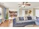 Open-concept living space with a comfortable blue sofa leading to a kitchen and dining area at 12217 Dearview Ln, Charlotte, NC 28269