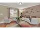 Cozy living room features hardwood floors, modern decor, and a large window, creating a relaxing ambiance at 12217 Dearview Ln, Charlotte, NC 28269