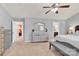 Spacious main bedroom with light-filled windows, carpet, and en-suite access at 12217 Dearview Ln, Charlotte, NC 28269