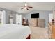 Main bedroom boasting a ceiling fan, bright windows, and neutral decor at 12217 Dearview Ln, Charlotte, NC 28269