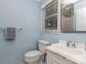 Bathroom with light blue walls, a sink, and a toilet at 1227 Seneca Pl, Charlotte, NC 28210