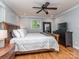 Bedroom features hardwood floors, a large bed, and generous natural light at 1227 Seneca Pl, Charlotte, NC 28210