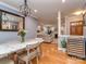 Open-concept dining room featuring hardwood floors and seamless flow to the living room at 1227 Seneca Pl, Charlotte, NC 28210