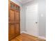 Inviting entryway with gleaming hardwood floors and stylish paneled doors, creating a warm and welcoming ambiance at 1227 Seneca Pl, Charlotte, NC 28210