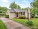 Charming home with a well-maintained lawn and a inviting front porch at 1227 Seneca Pl, Charlotte, NC 28210
