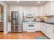 Well-equipped kitchen offers stainless steel appliances, white cabinets, hardwood floors, and ample storage at 1227 Seneca Pl, Charlotte, NC 28210