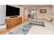 Open-concept layout provides a seamless flow between the living room, dining area and neutral walls with wood accents at 1227 Seneca Pl, Charlotte, NC 28210