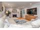 Bright living room features hardwood floors, recessed lighting, a cozy fireplace, and ample seating space at 1227 Seneca Pl, Charlotte, NC 28210