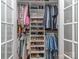 Spacious walk-in closet with built-in shelving and ample storage for clothes and shoes at 1227 Seneca Pl, Charlotte, NC 28210