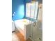 Primary bathroom with a tiled bathtub, shower with glass doors, and 'Soak Enjoy Relax' wall art at 12304 Sandringham Pl, Charlotte, NC 28262