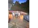 Outdoor deck with dining table, chairs, and string lights, ideal for entertaining guests at 12304 Sandringham Pl, Charlotte, NC 28262
