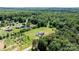 Residential area featuring single-Gathering homes, a swimming pool, and lush greenery at 125 Carter Ln, Statesville, NC 28625