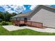 Exterior view of the home with wooden deck and concrete patio at 125 Carter Ln, Statesville, NC 28625