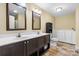 Spacious bathroom with double sink vanity and walk-in tub for comfort and accessibility at 125 Carter Ln, Statesville, NC 28625