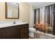 Cozy bathroom with single sink vanity, toilet, and bathtub featuring a decorative shower curtain at 125 Carter Ln, Statesville, NC 28625