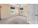 Bedroom featuring neutral walls, carpet floors, and multiple windows for ample natural light at 125 Carter Ln, Statesville, NC 28625