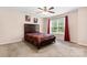 Comfortable bedroom with neutral tones, window, and ceiling fan at 125 Carter Ln, Statesville, NC 28625