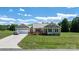Charming single-story home with a two car garage, handicap ramp, and well-maintained lawn at 125 Carter Ln, Statesville, NC 28625