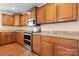 Modern kitchen with stainless steel appliances, granite counters, and custom cabinetry at 125 Carter Ln, Statesville, NC 28625