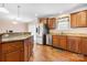 Open kitchen with stainless steel appliances, island, and adjoining dining area with natural light at 125 Carter Ln, Statesville, NC 28625