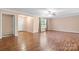 Inviting living room featuring hardwood flooring, and a view of the entryway at 125 Carter Ln, Statesville, NC 28625