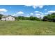 Sprawling green lawn surrounds this peaceful country house at 125 Carter Ln, Statesville, NC 28625
