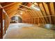 Unfinished attic space with exposed beams, wooden floors and an open layout, great for storage at 1295 Patterson St, China Grove, NC 28023