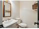 Classic powder room with pedestal sink and paneled walls at 1295 Patterson St, China Grove, NC 28023