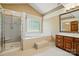 Bathroom featuring large tub, stand up shower and wood vanity at 1295 Patterson St, China Grove, NC 28023