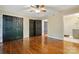 Bedroom with hardwood floors, ceiling fan, and dual closets, offering style and storage at 1295 Patterson St, China Grove, NC 28023