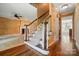 Inviting entryway with staircase, hardwood floors, and classic decor at 1295 Patterson St, China Grove, NC 28023