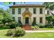 Charming two-story home features a classic design, a brick walkway, and meticulously manicured landscaping at 1295 Patterson St, China Grove, NC 28023